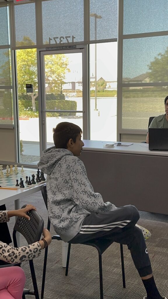 Students participating in chess camp at Y2L Academy.